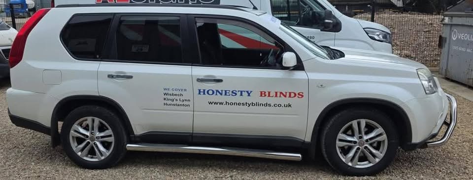 White Honesty Blinds vehicle, with Wisbech, King's Lynn and Hunstanton listed on the door