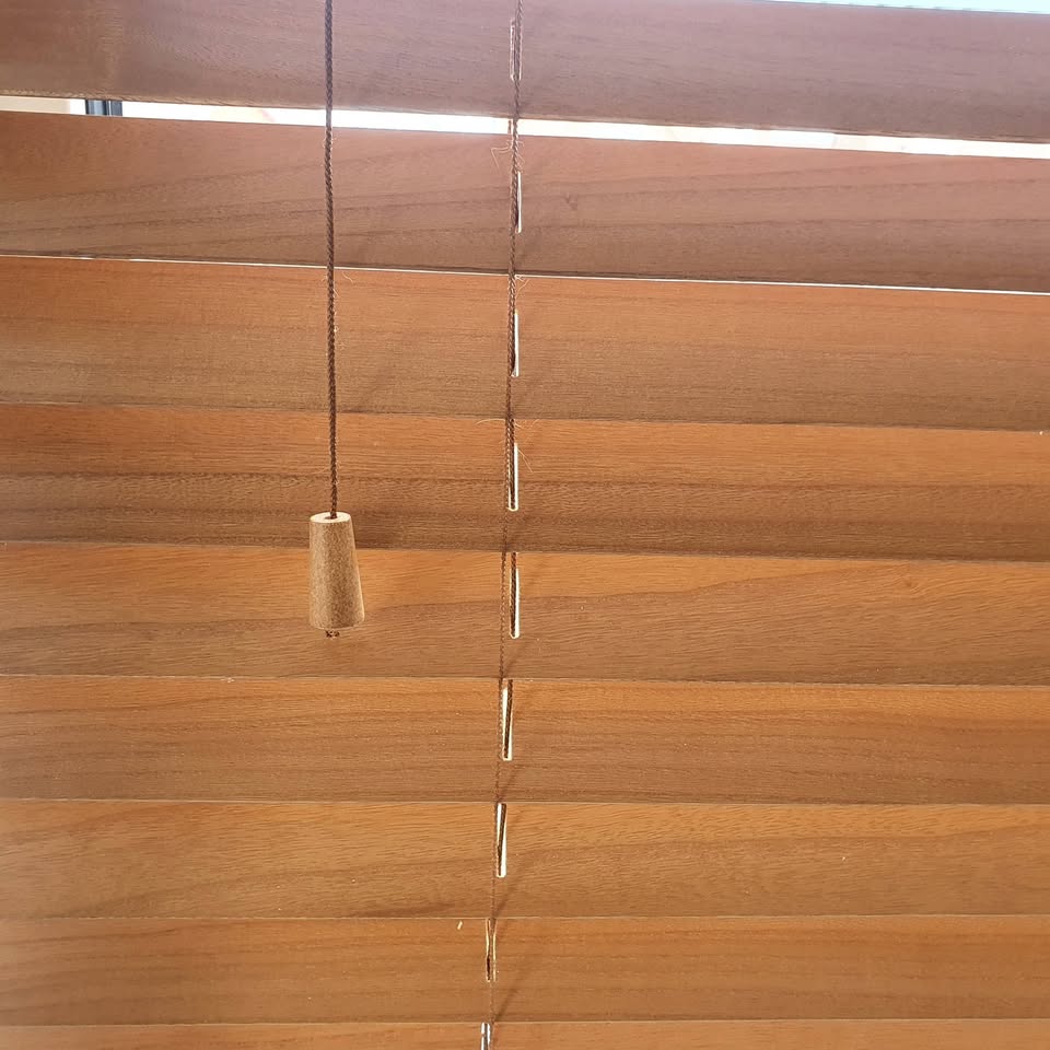 Close view of warm wooden venetian blind slats